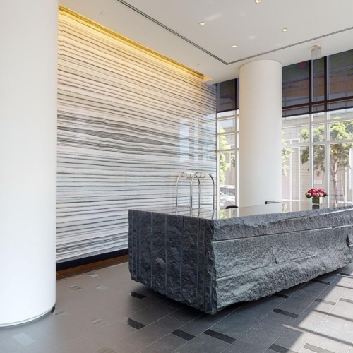 Views of nature from modern lobby lobby and lounge area with wooden ceilings