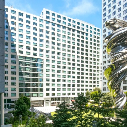 Find your perfect fit at 1188 Mission SOMA, CA Apartments - Trinity Place At 1188 - Outside Courtyard Featuring A Statue