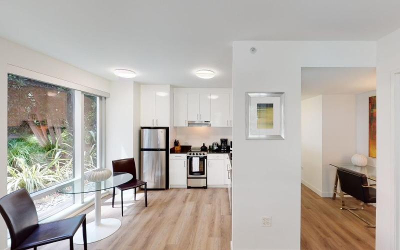 a kitchen with white cabinets